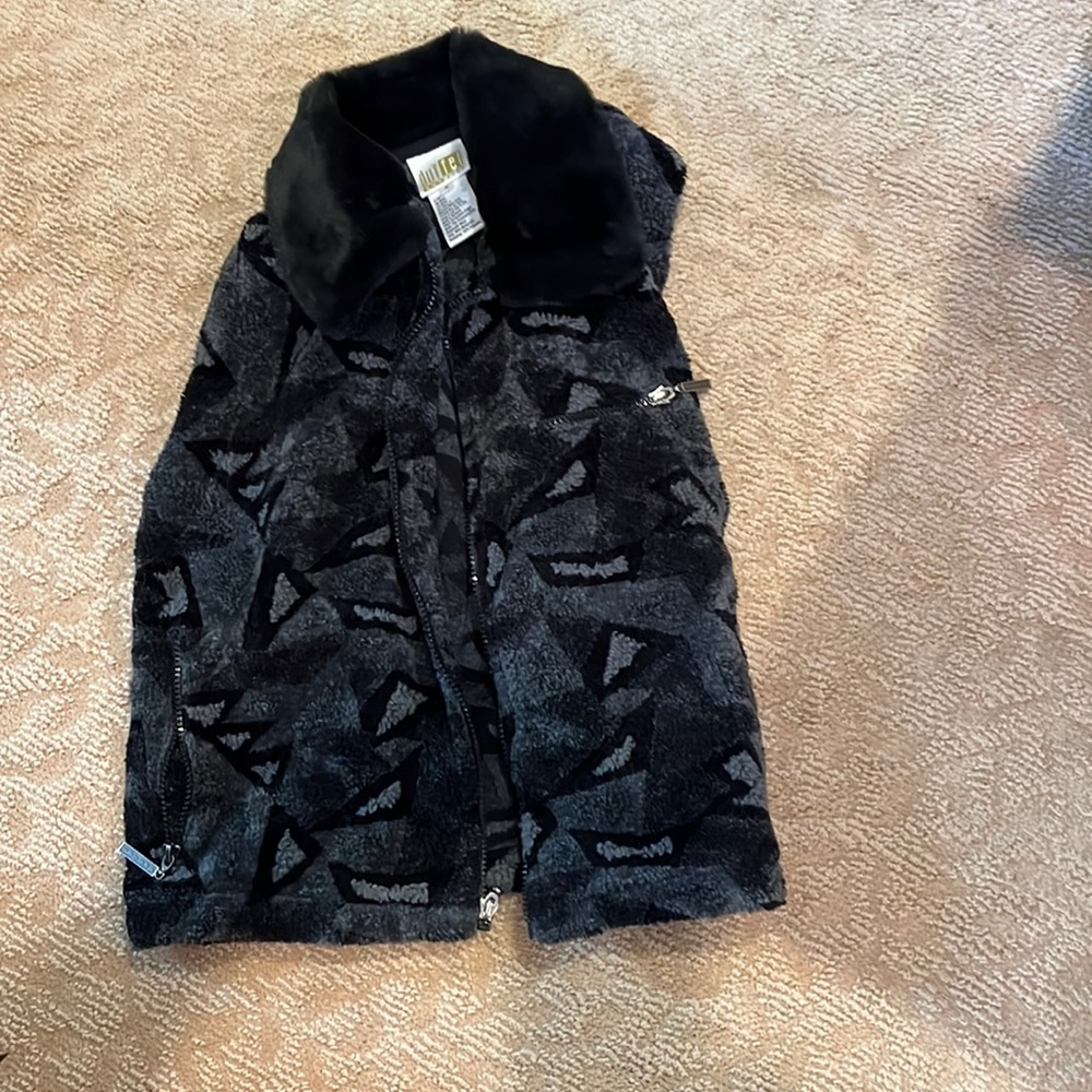 Woman’s black and grey patterned vest